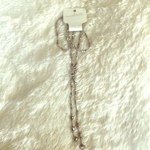 Silver beaded “knot” style necklace